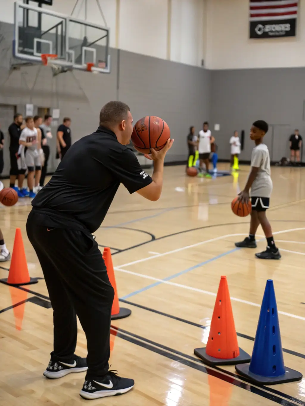 A coach providing one-on-one basketball training to a young player, focusing on shooting techniques and personalized skill development.